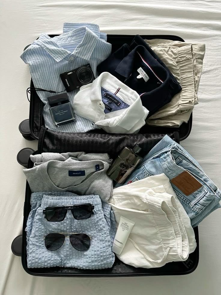 Men's travel suitcase — stripe shirts, denim, neutral knits