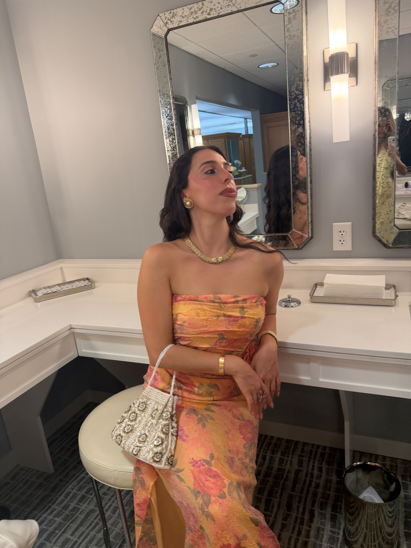 Floral event gown styled with accessories